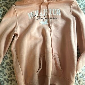 a very cute pink medium hollister sweatshirt